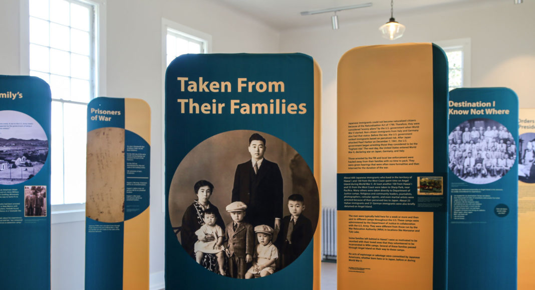 Photograph of boards with words and pictures that are part of a historical exhibit