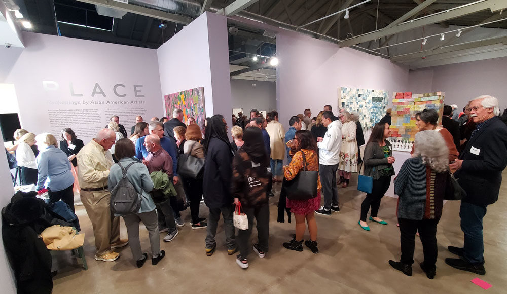 Crowd of people at an art museum event