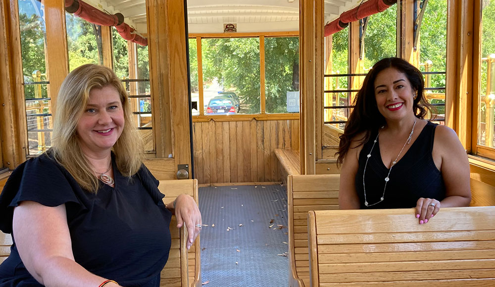 Two women sitting in a trolley