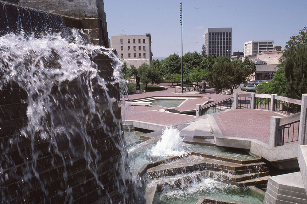 Different view of the downtown fountain, showing platforms surrounded by water streaming over steps.