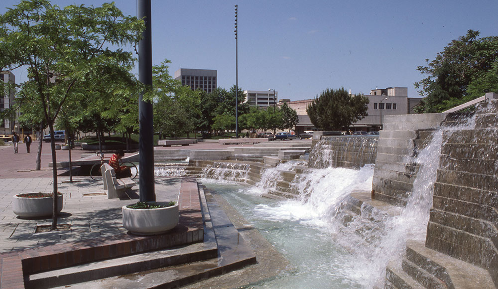 Urban fountain with water flowing over cement steps