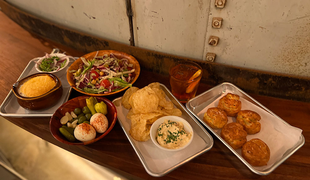 Mix of dishes laid out on a narrow table ledge