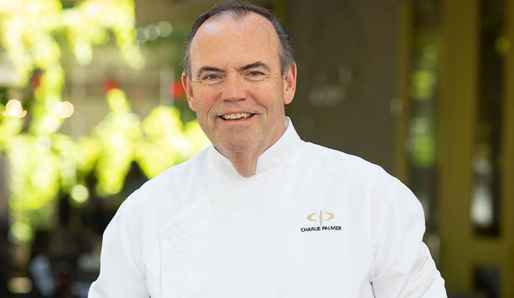 Portrait of man wearing chef’s white jacket