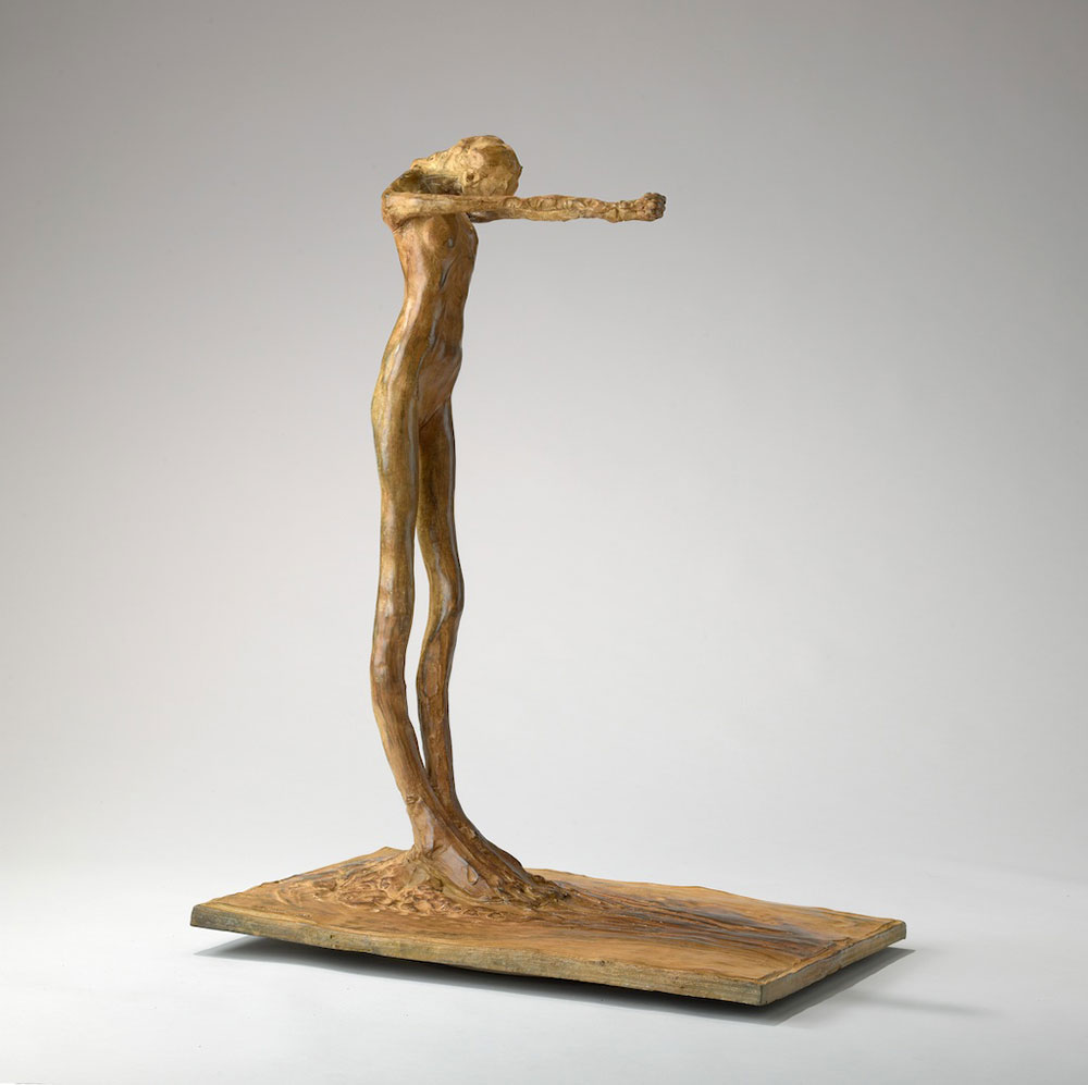 Attenuated sculpture of a human body, standing with arms outstretched