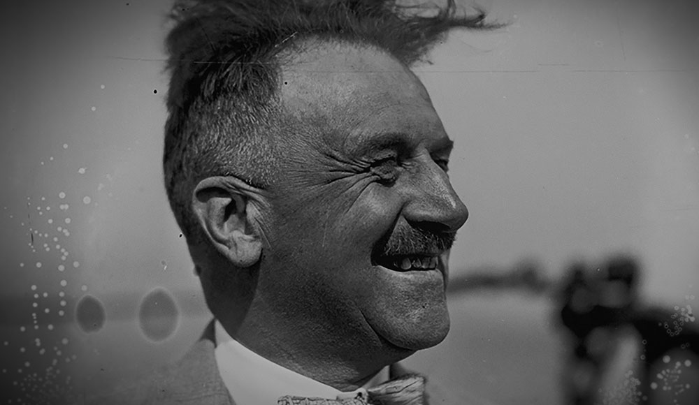 Archival black-and-white photo of a man in profile