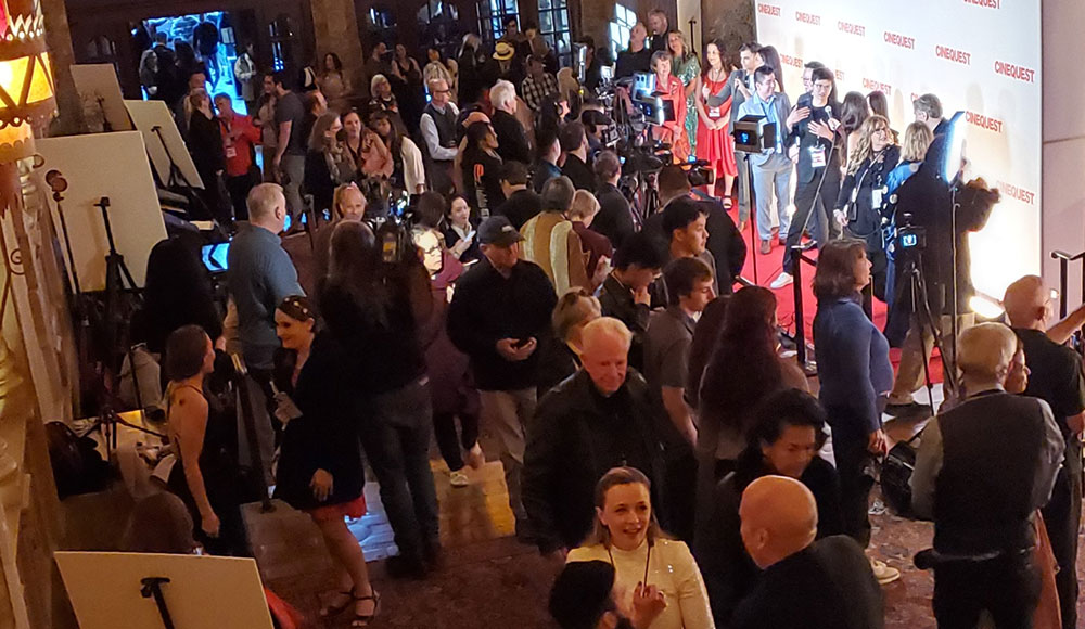 Crowd at a film festival premiere, seen from overhead