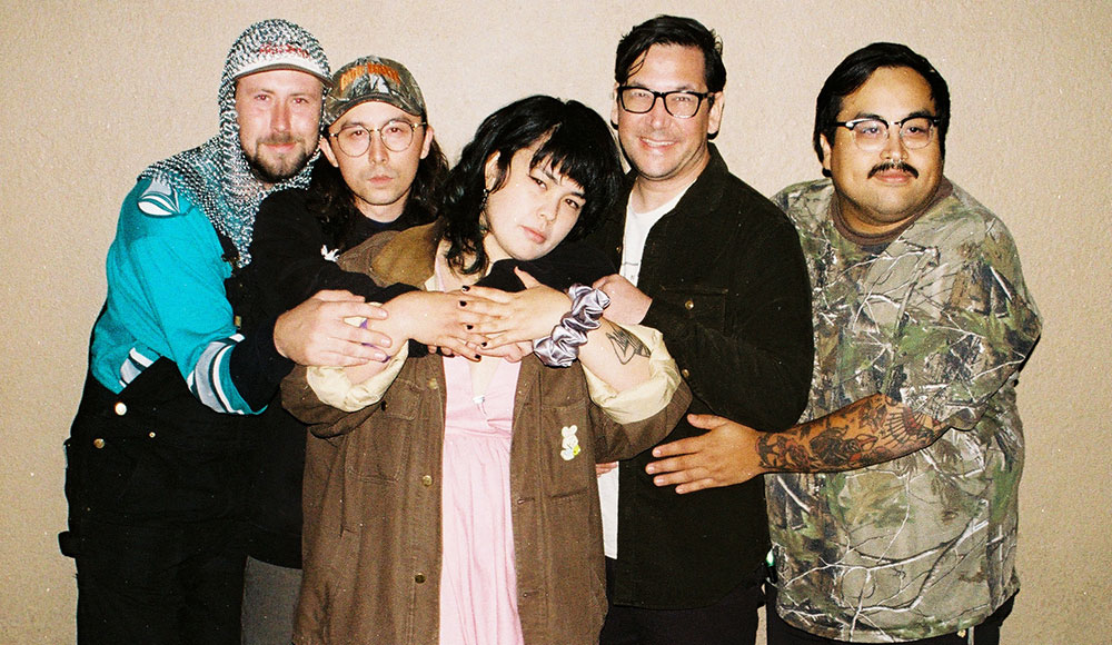 Five people posing for a photo