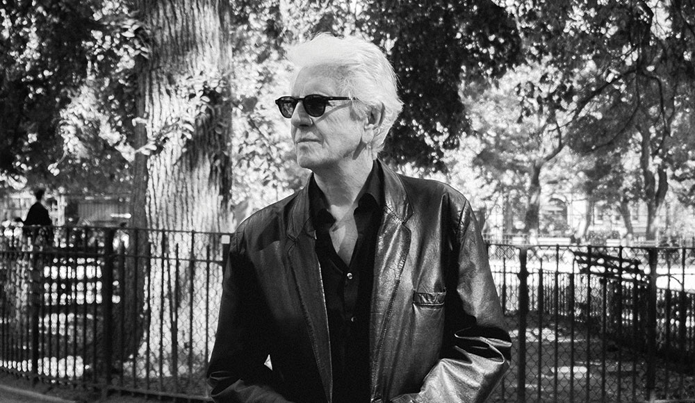 Man standing outside around trees