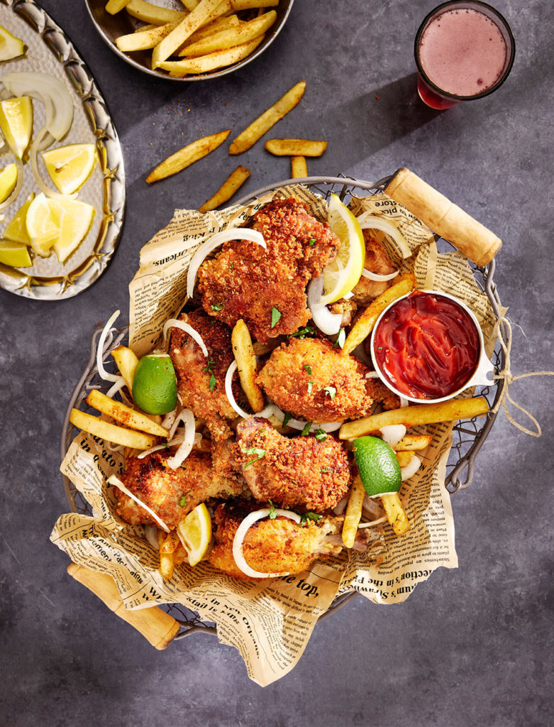 Full serving platter with a hand serving some of the food