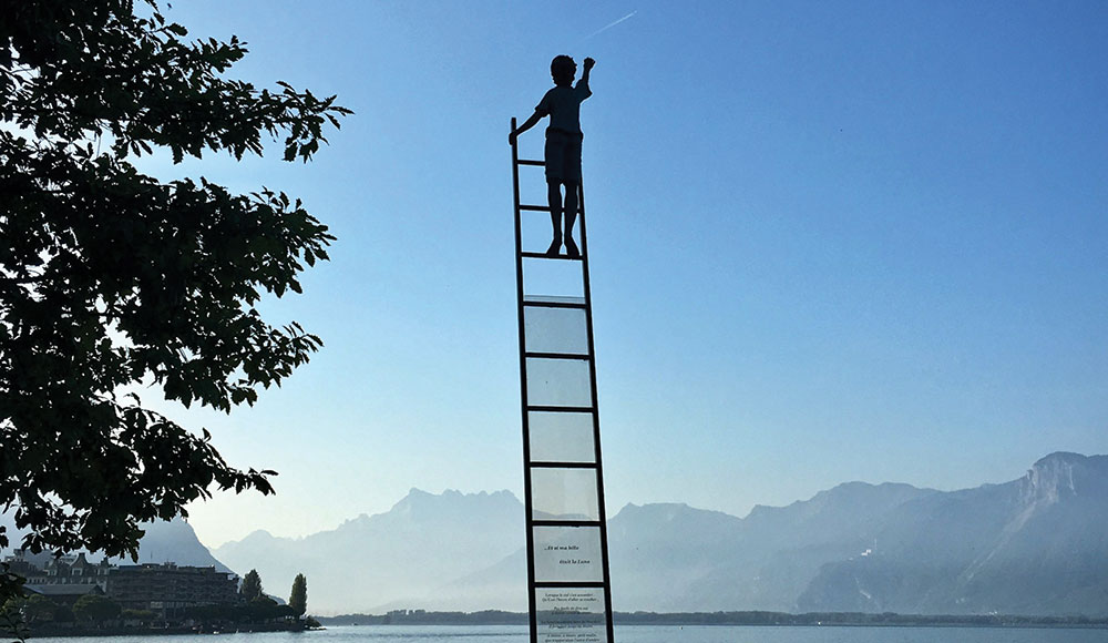 Person climbing a ladder into the sky