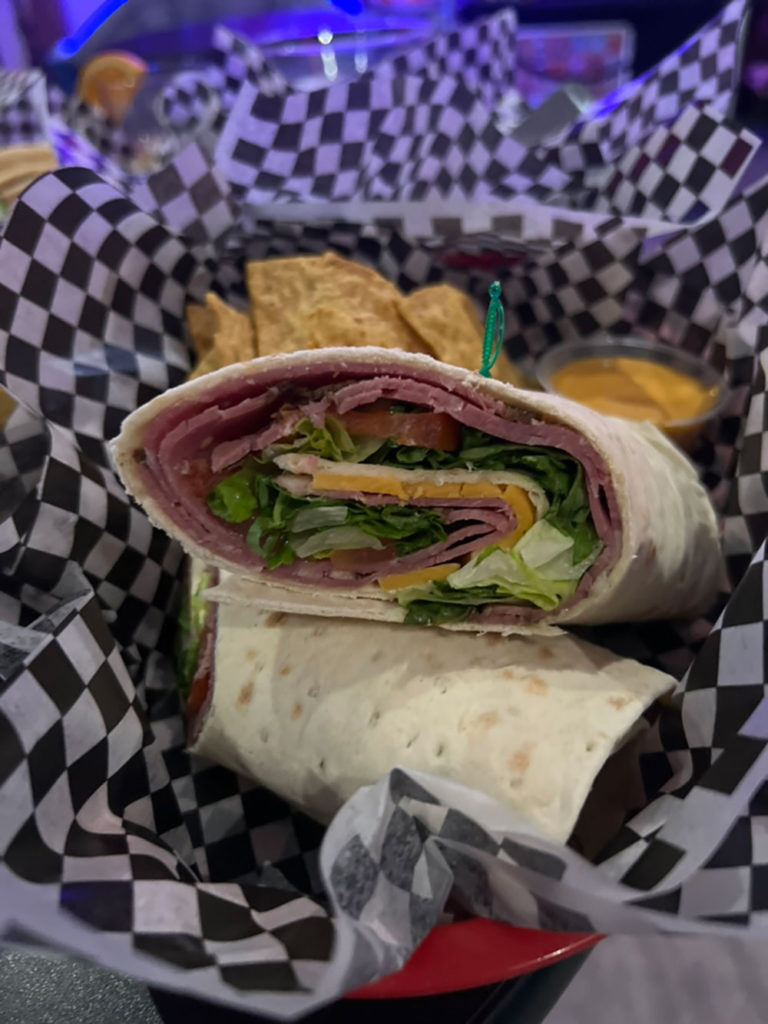 Lavash roll stuffed with meat, cheese and lettuce