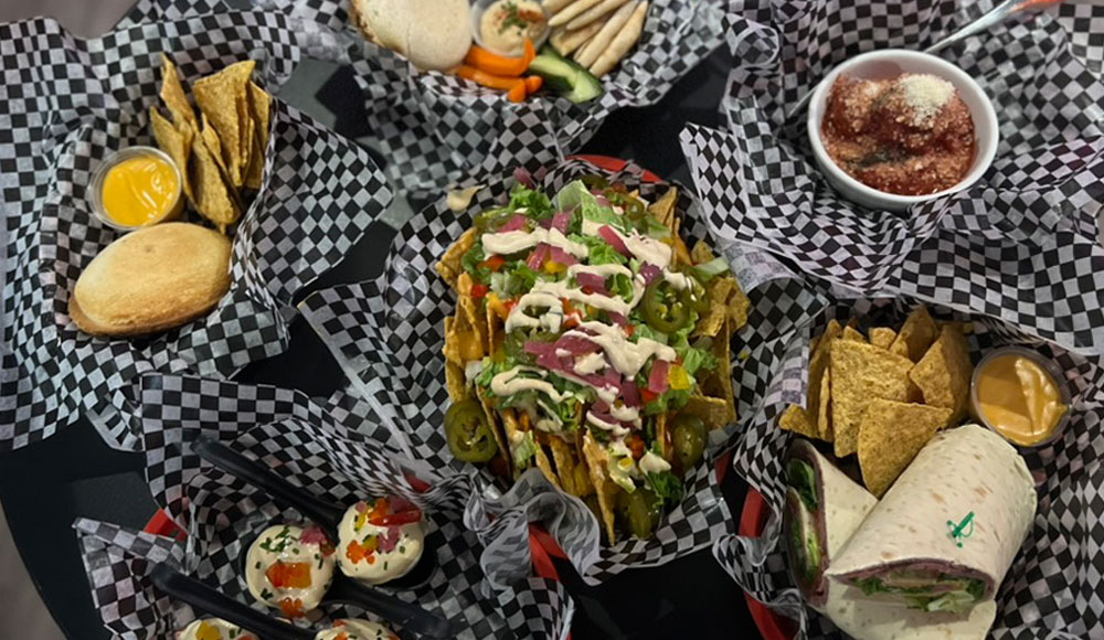 Several baskets of different kinds of food photographed from overhead