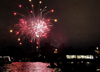 Fireworks seen over a lake