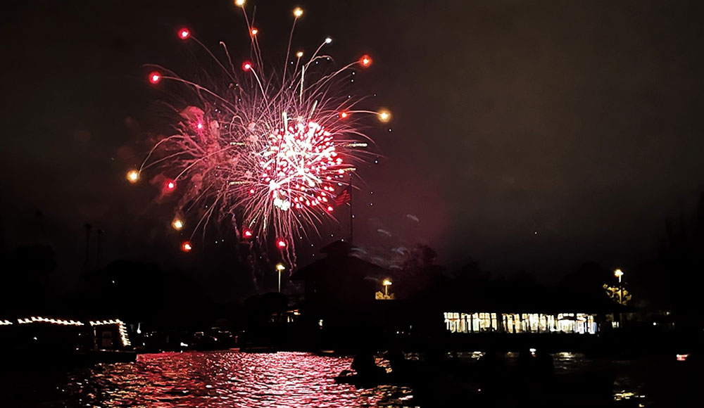 Fireworks seen over a lake