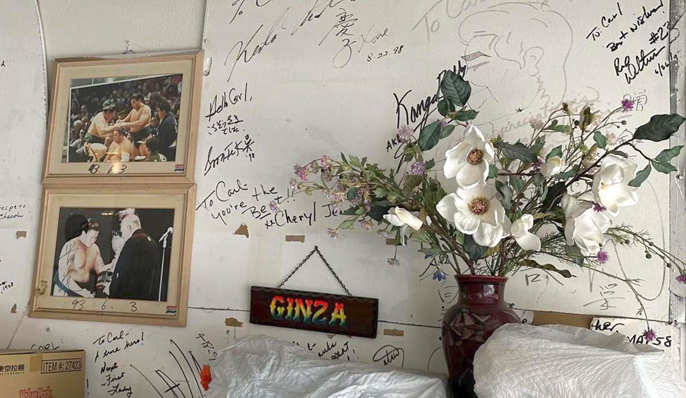 Wall in a storage area with writing on it