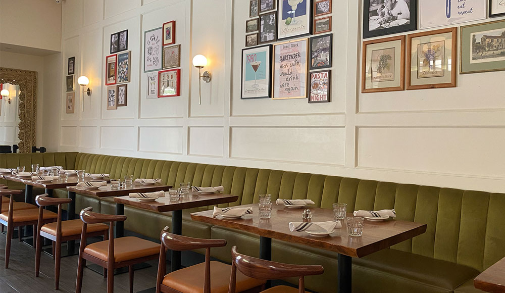 Interior of a restaurant with lots of artwork on the walls