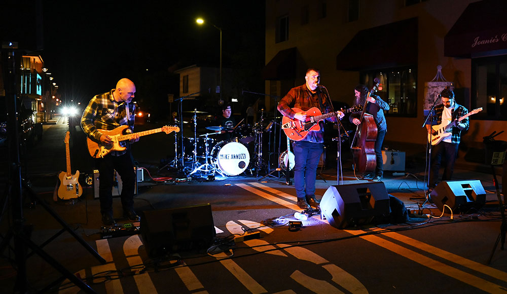 Musicians playing on a stage