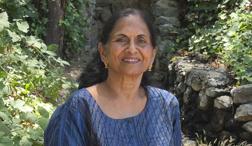 Woman posing for a photo outside