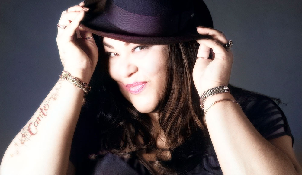 Woman posing with a hat on