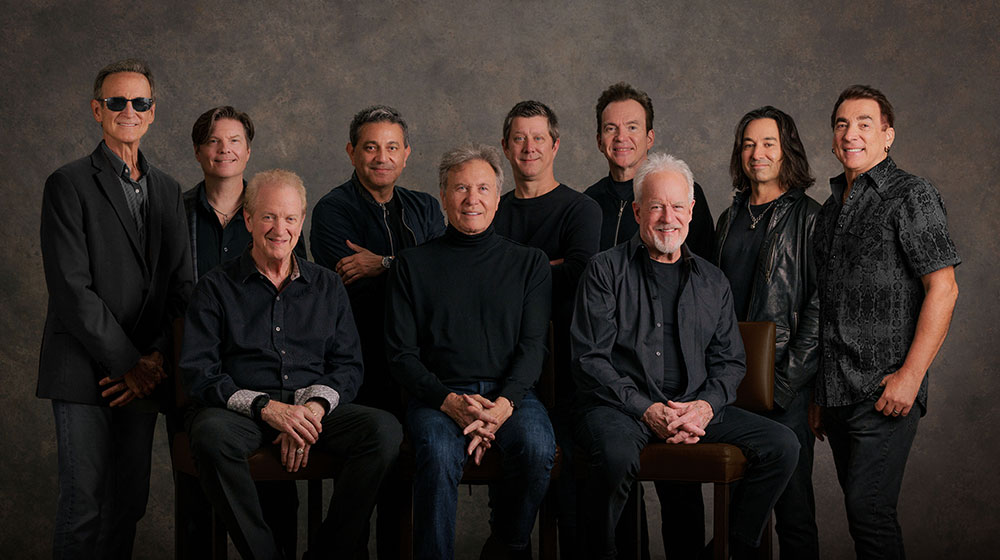 10 musicians posing for a formal band portrait