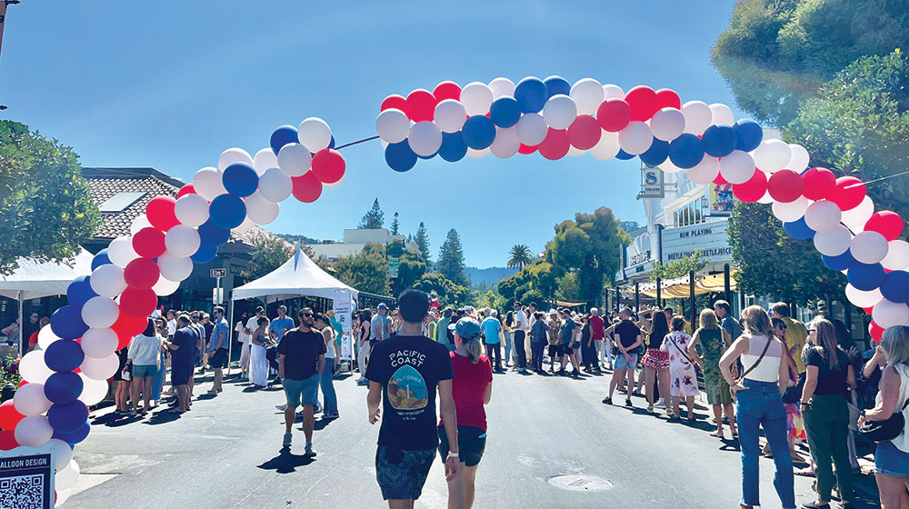 Street fair with balloons and booths