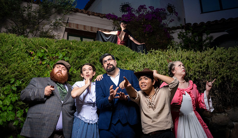 Six people posing for a production shot