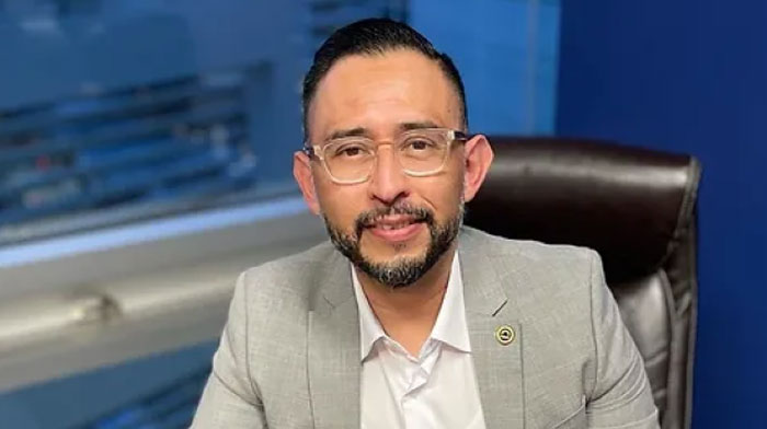Man in a suit sitting at a desk