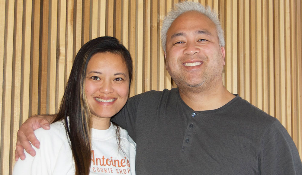 Man and woman posing for photo