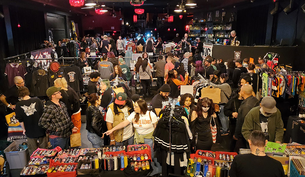 Nightclub filled with people selling merchandise