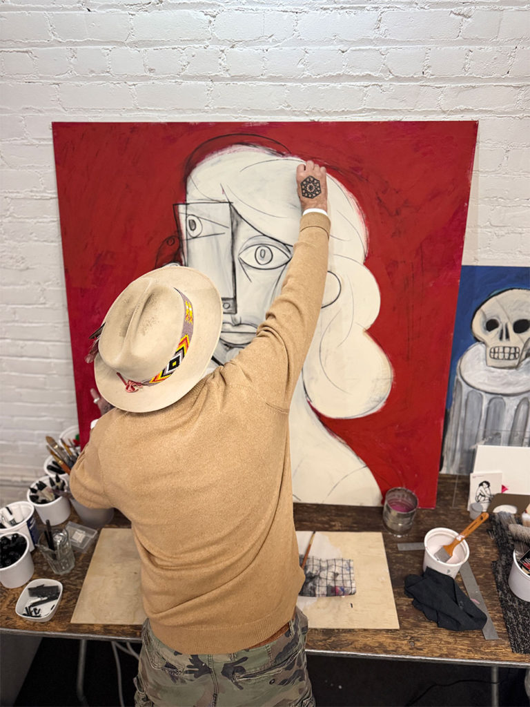 Man painting on a canvas