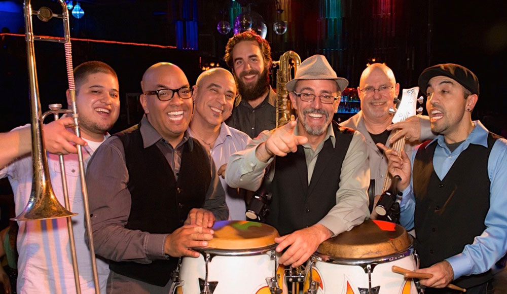 Group of musicians posing for a photo